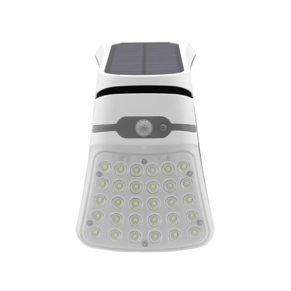 Foco solar LED exterior blanco con sensor de movimiento y panel solar integrado para pared y jardín