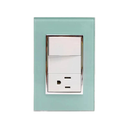 Placa decorativa de vidrio aqua para pared con un interruptor de luz y un tomacorriente doble, marco cromado.