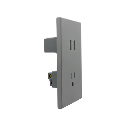 Tomacorriente doble gris mate con placa de pared minimalista para instalaciones eléctricas modernas.